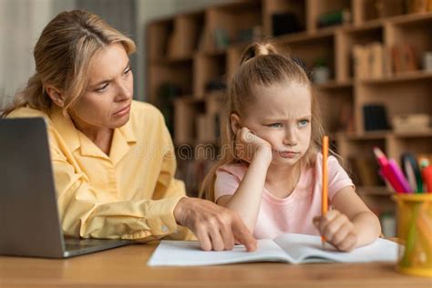 strict mother scolding upset daughter for bad marks or school exam results mum lecturing