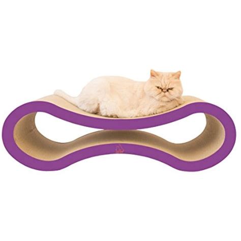 A White Cat Laying On Top Of A Purple And Beige Wave Shaped Bed With