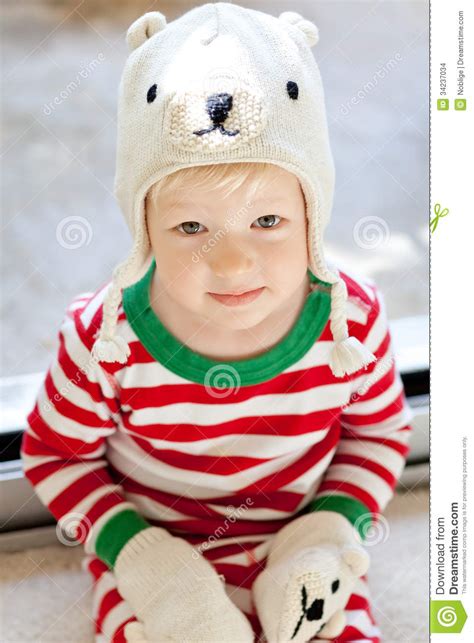 Funny kid in a baby seat. Cute toddler stock photo. Image of people, cheerful, bear ...