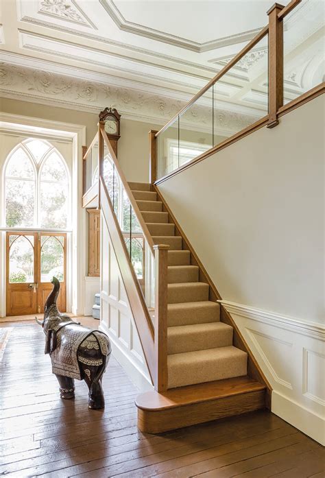 A modern design maintains simplicity and uniformity. Dark Oak In-Line Glass Staircase | Neville Johnson