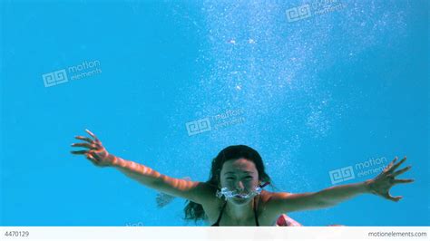 Happy Brunette Underwater In Swimming Pool Stock Video Footage 4470129