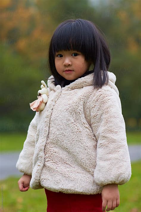 one little asian girl outdoor in the park by stocksy contributor bo bo stocksy