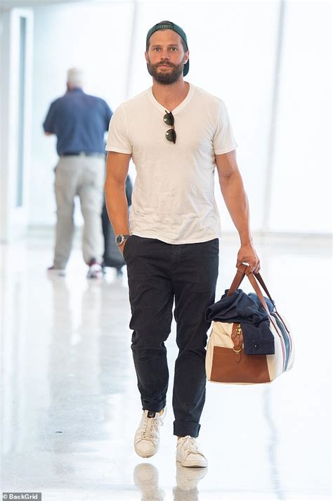 jamie dornan looks effortlessly stylish in a white t shirt and jeans daily mail online jamie