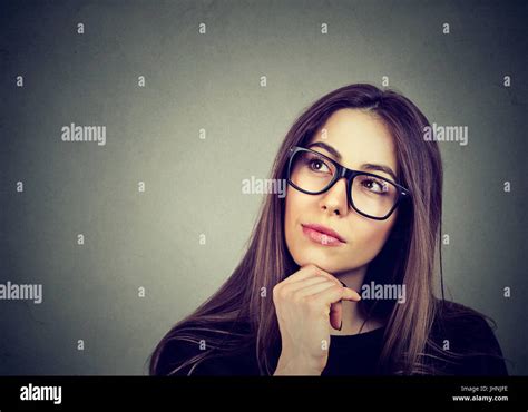 Portrait Of A Beautiful Young Woman Thinking Stock Photo Alamy