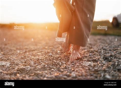 Close Up Of Womans Barefoot Feet Walking On Rock Beach Stock Photo Alamy