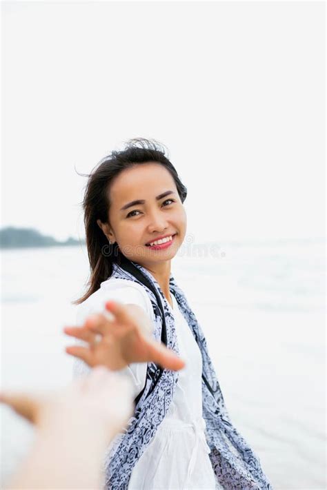 Asian Men And Women Shake Hands On The Beach Stock Image Image Of