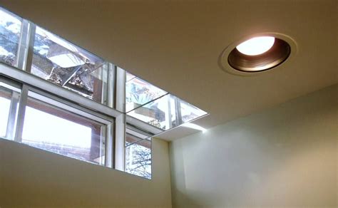 mirrors around basement window to increase natural light basement remodeling basement ceiling