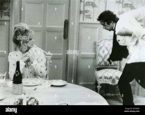 American Actress Goldie Hawn And Actor Chevy Chase In The Movie Seems