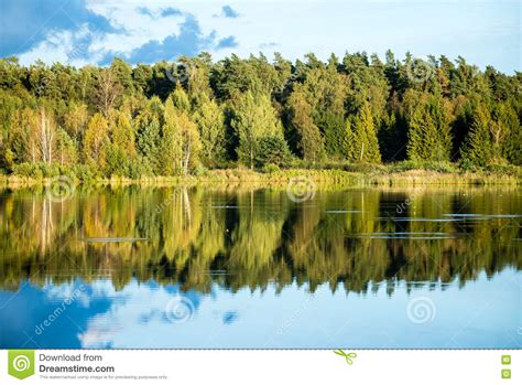 Beautiful Autumn Sunset At The Lake With Blue Sky Red And