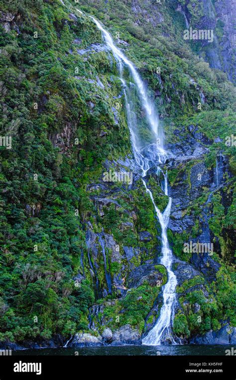 Huge Waterfall In The Milford Sound South Island New Zealand Stock