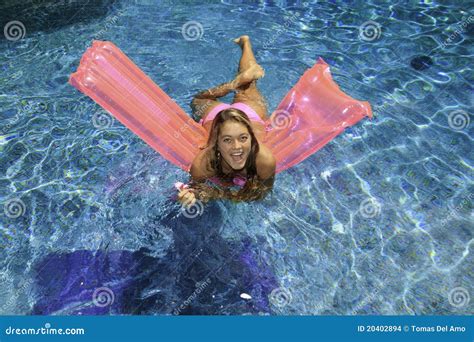 teen girl in pink bikini on a float stock images image 20402894