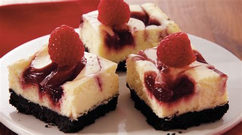 This is so rich and creamy and the raspberry sauce is sweet and tart. Raspberry-Swirl Cheesecake Bars recipe from Betty Crocker