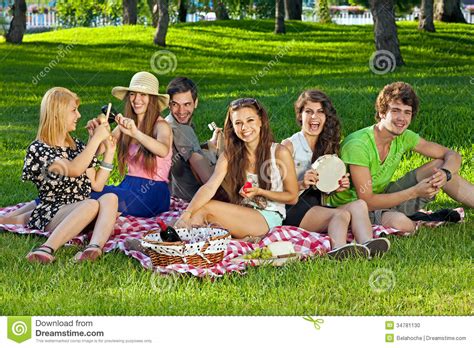 College Students Enjoying A Picnic In The Park Stock Photo Image Of