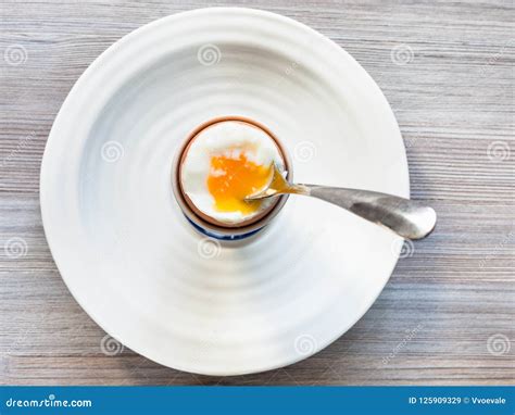 Soft Boiled Brown Egg With Spoon In Cup On Plate Stock Image Image Of