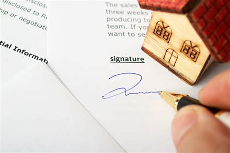 New Homeowner Signing Contract Of House Sale Stock Photo Download