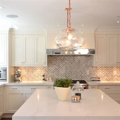 Take rose gold accents, for example. Herringbone backsplash, rose gold accents and a Frosty ...