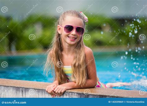 Cute Cheerful Smiling Girl In Sunglasses In The Pool On Holiday Summer Time Stock Image Image