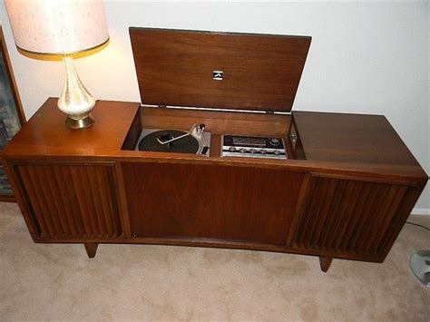 This cabinet is the perfect size to place your record player and the metal record dividers offer plenty of options to keep your albums organized. 1960s stereo console |1970s stereo console; loved ours! It ...