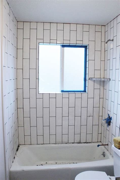 So i enhanced it with beautiful mother of pearl and glass mosaic centerpiece over the existing tile. How to Tile a Shower-Tub Surround, Part 2: Grouting ...