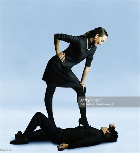 Woman Standing Over Man Lying Down Photo Getty Images