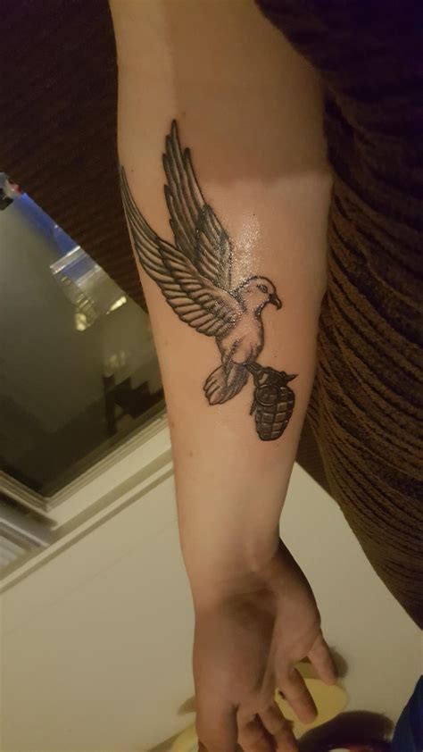 Dove and grenade. Done at Tattoo Technique in Bremerton Washington by