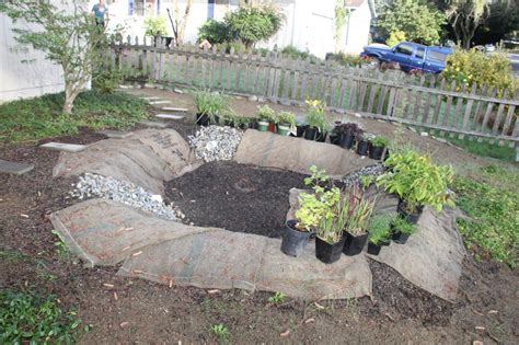 It doesn't really solve a soggy yard problem, but a rain garden looks a lot better than a muddy hole. How to Build a Rain Garden | DIY Network Blog: Made ...