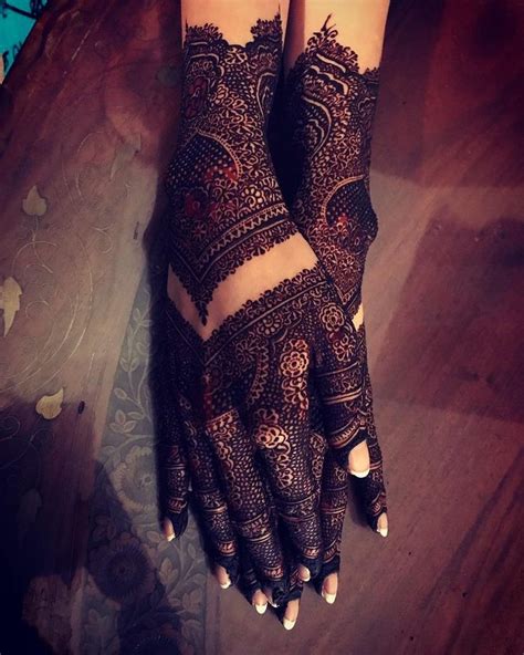 A Womans Hand With Henna On It