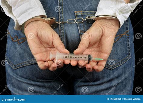 Handcuffed Back Woman With A Syringe In Her Hands Stock Image Image Of Syringe Medical 147585855