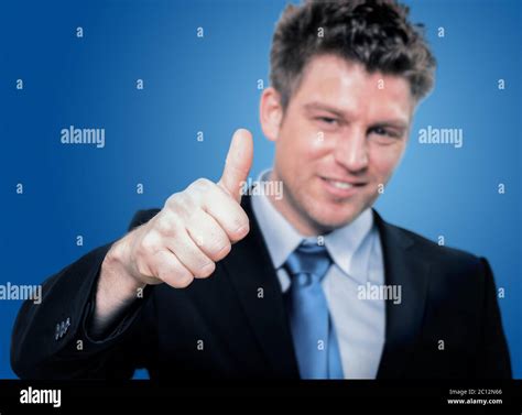 Happy Handsome Business Man Holding Thumbs Up Stock Photo Alamy