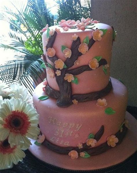 A fresh floral birthday cake is sure to make someone's day! Two tier pink birthday cake with tree trunk and pink ...