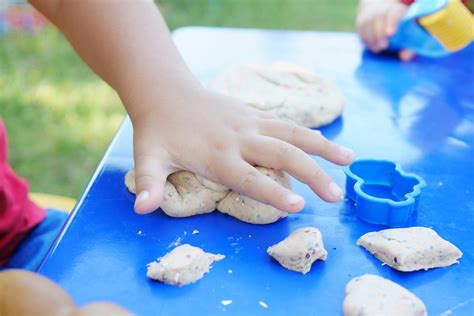 Photo Of Childs Hand Playing Clay · Free Stock Photo