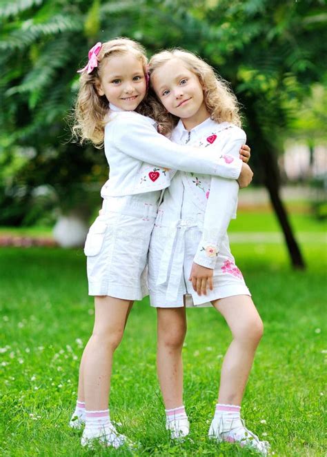 Portrait Of Two Sisters Twins Stock Photo Image Of Small Smiling