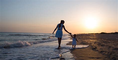 Mother And Child Walking Along The Seashore 4 By