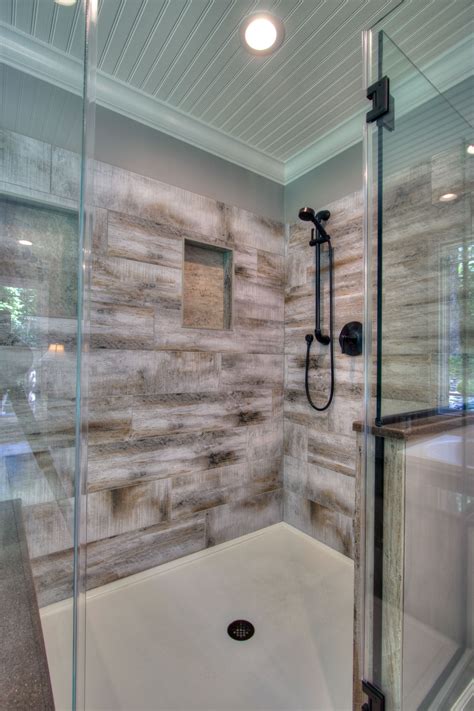 Generous Walk In Shower With Bench Seating Has Wood Look Porcelain Tile For The Surround Dream