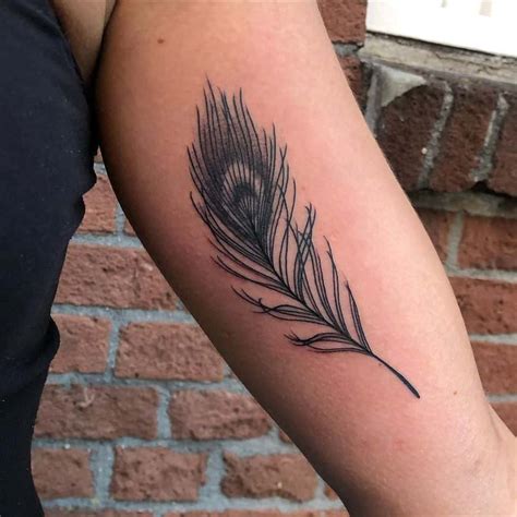 Small Peacock Feather Tattoo Done At Ripz Tattoo Feather Tattoo Design Tattoo Designs Wrist