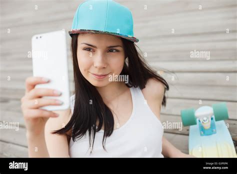 Pretty Young White Girl Taking Selfie Photo With Her Huge Modern