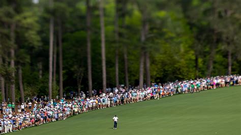 Masters Champion Tiger Woods Of The United States Draws A Crowd Of