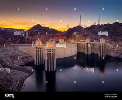 Hoover Dam And Bypass Bridge At Sunset With Lake Mead Stock Photo Alamy