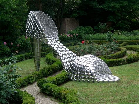 giant shoes made of pots pans and lids designed by paris born lisbon based artist joana