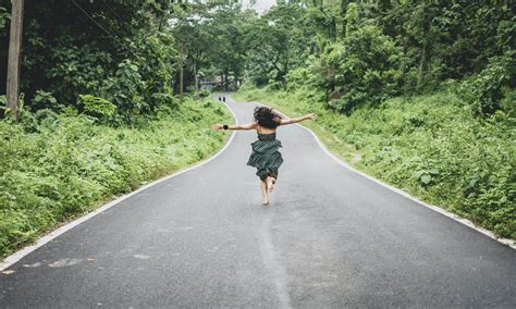 Woman Running On Road · Free Stock Photo