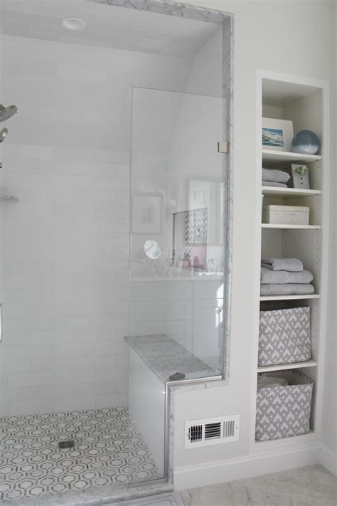 Continuing themes on other surfaces within your. Walk in tiled shower with bench and built in towel storage ...