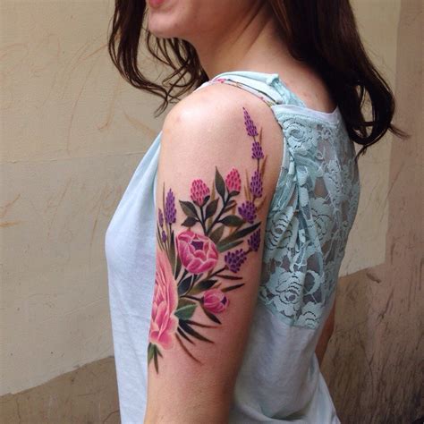 Excellent Flower Tattoo On The Upper Arm