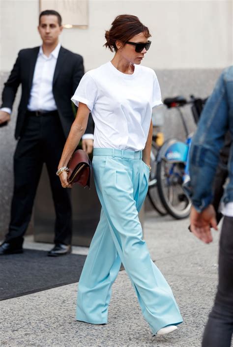 Victoria Beckham Wears White T Shirt And Blue Pants Popsugar Fashion