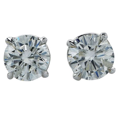 With a variety of stone shapes and each single diamond weighing at 0.50 carats each, diamond stud's 1 ct. 1.87 Carat Diamond Solitaire Stud Earrings For Sale at 1stdibs