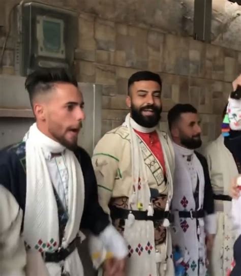 Assyrian Men Dancing Traditional Khigga While Wearing Khomala Arab