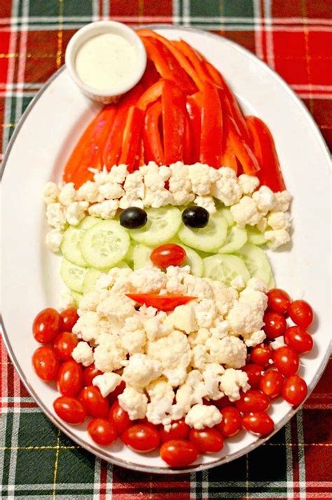 Topped with strawberry santa hats, these squares are sure to become a holiday favorite. Santa Claus made from vegetables food art | Best christmas appetizers, Christmas vegetables ...