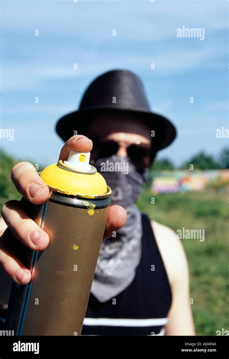 A Man Holding A Can Of Spray Paint Stock Photo Alamy