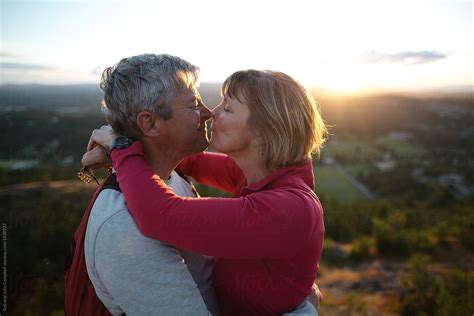 Fit Active Middle Age Couple Hiking Together At Sunset By Stocksy Contributor Rob And Julia