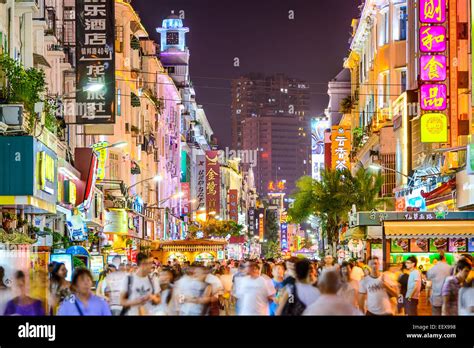 Pedestrians Walk On Zhongshan Road At Night In Xiamen China Stock