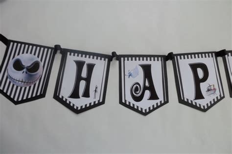 A Banner That Says Happy Halloween Hanging On A Wall With Jack